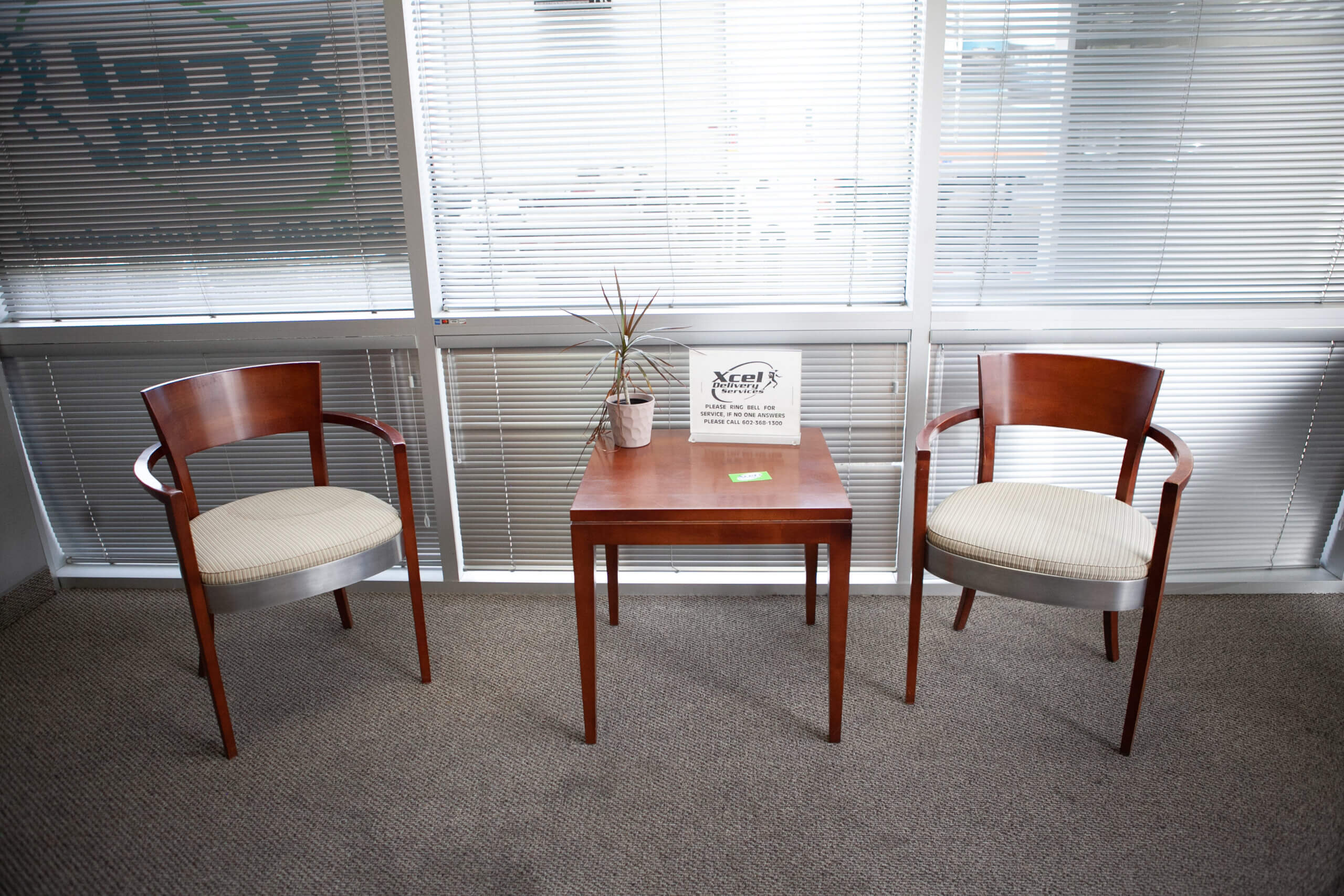 2 chairs and a small table in the Phoenix distribution center lobby